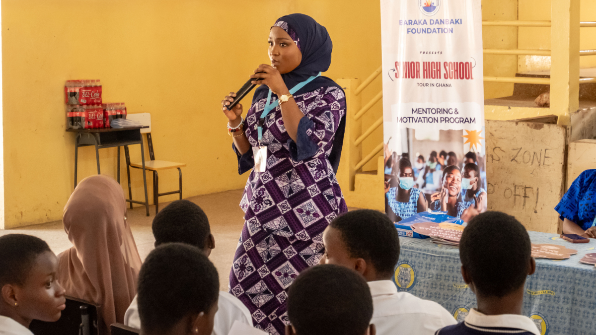 A mentor working with a small group of students