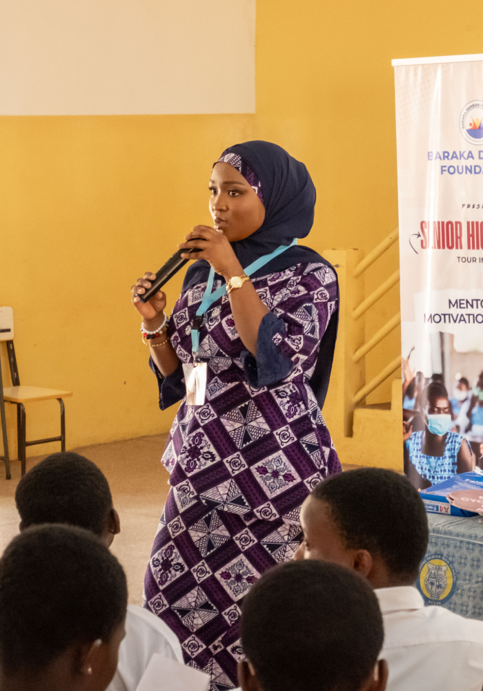 A mentor speaking in front of her peers